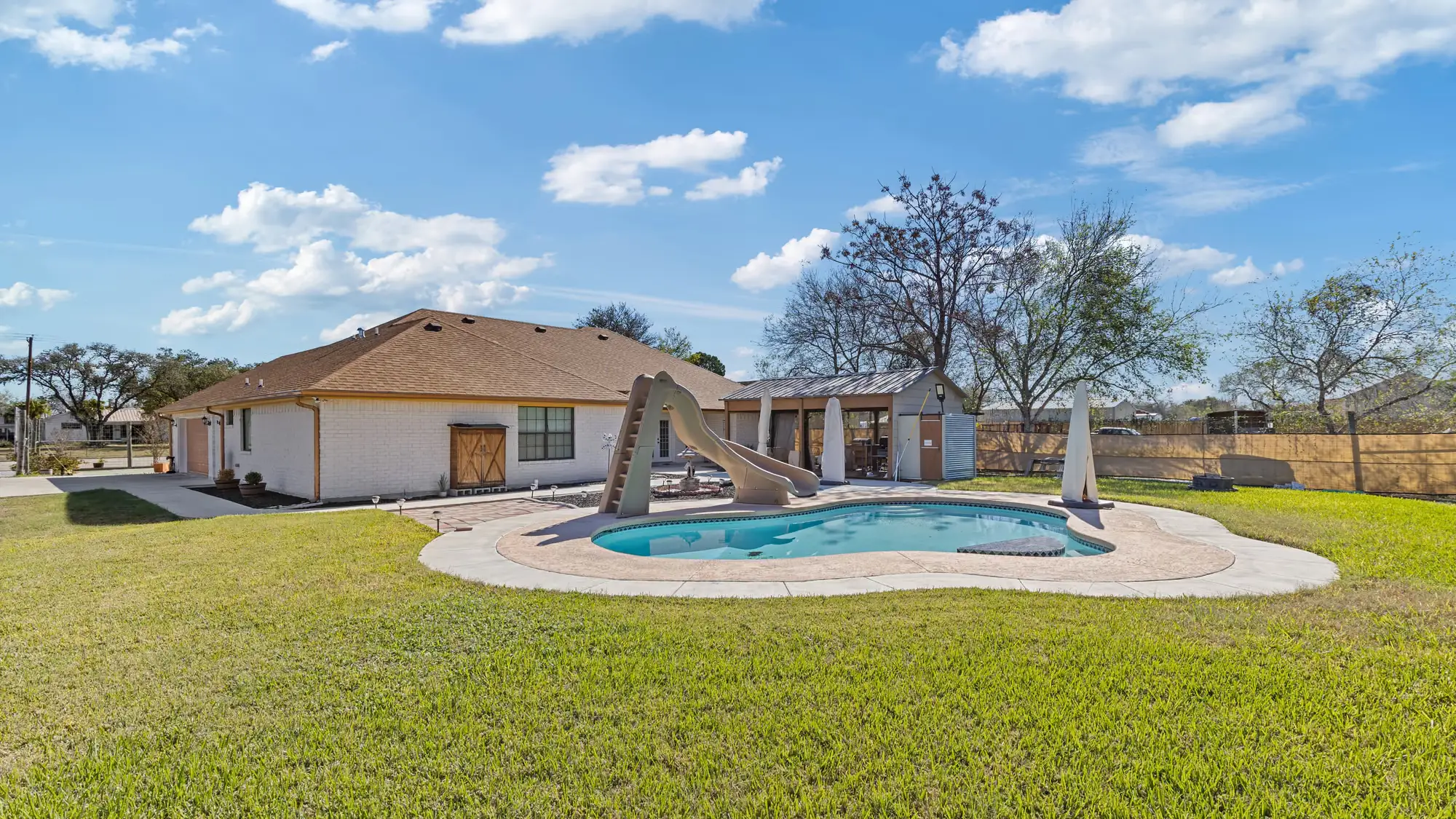 Rear of the house with the pool and the yard still being finished