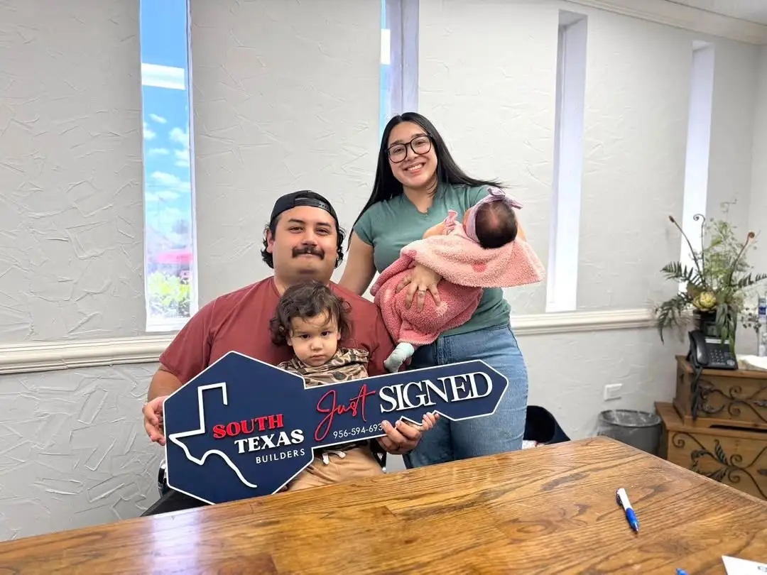 The Hernandez family with their newborn daughter on signing day