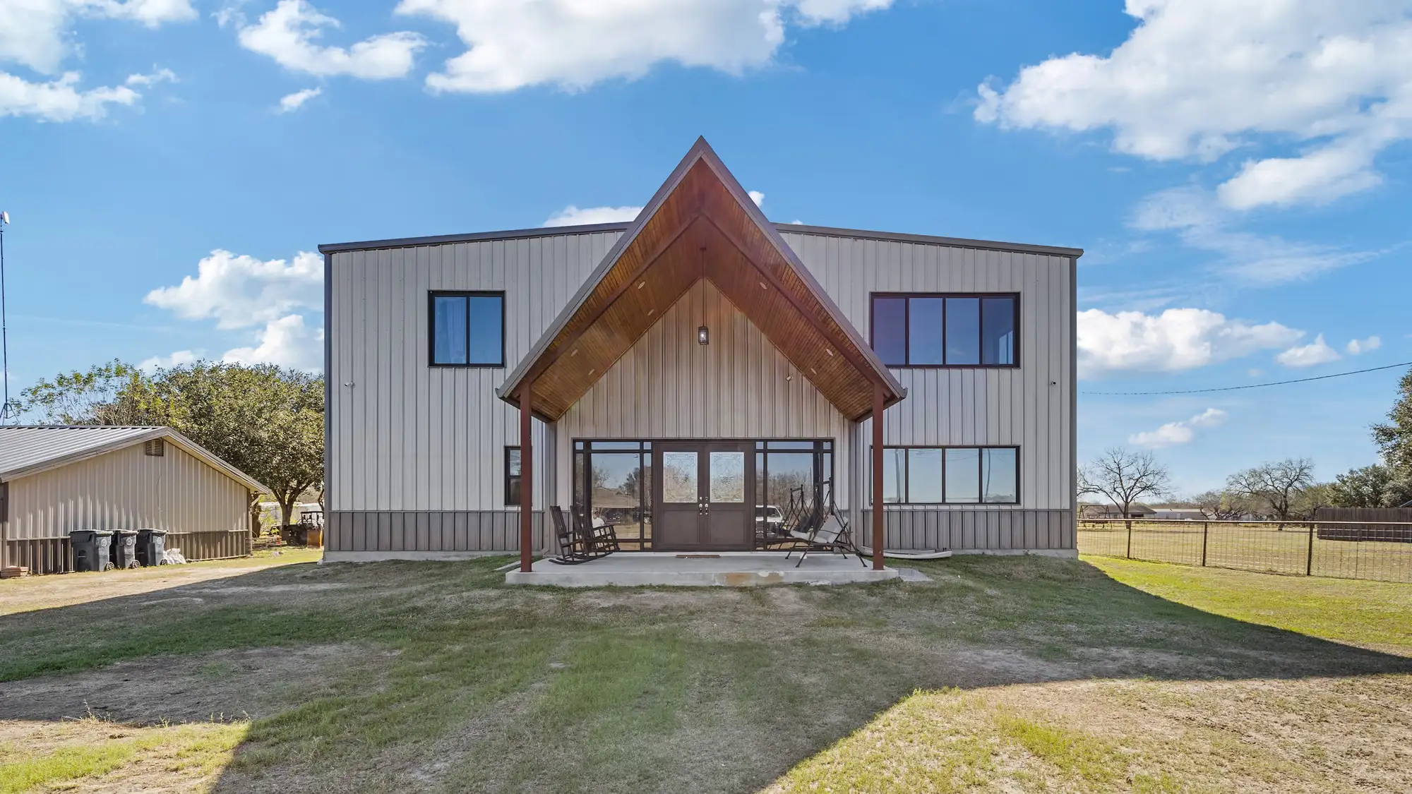 Wood entry gable with double-height glass doors