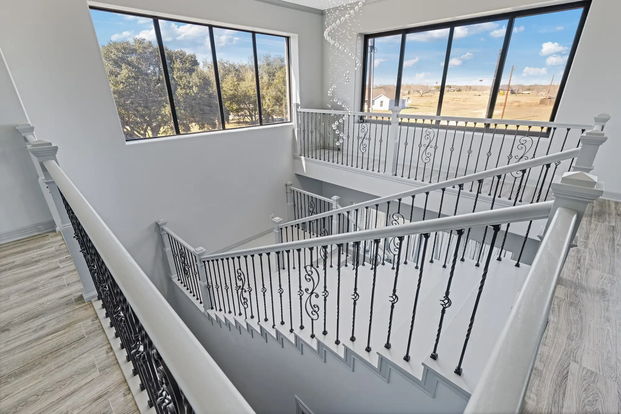Stair landing looking back across the full height of the volume