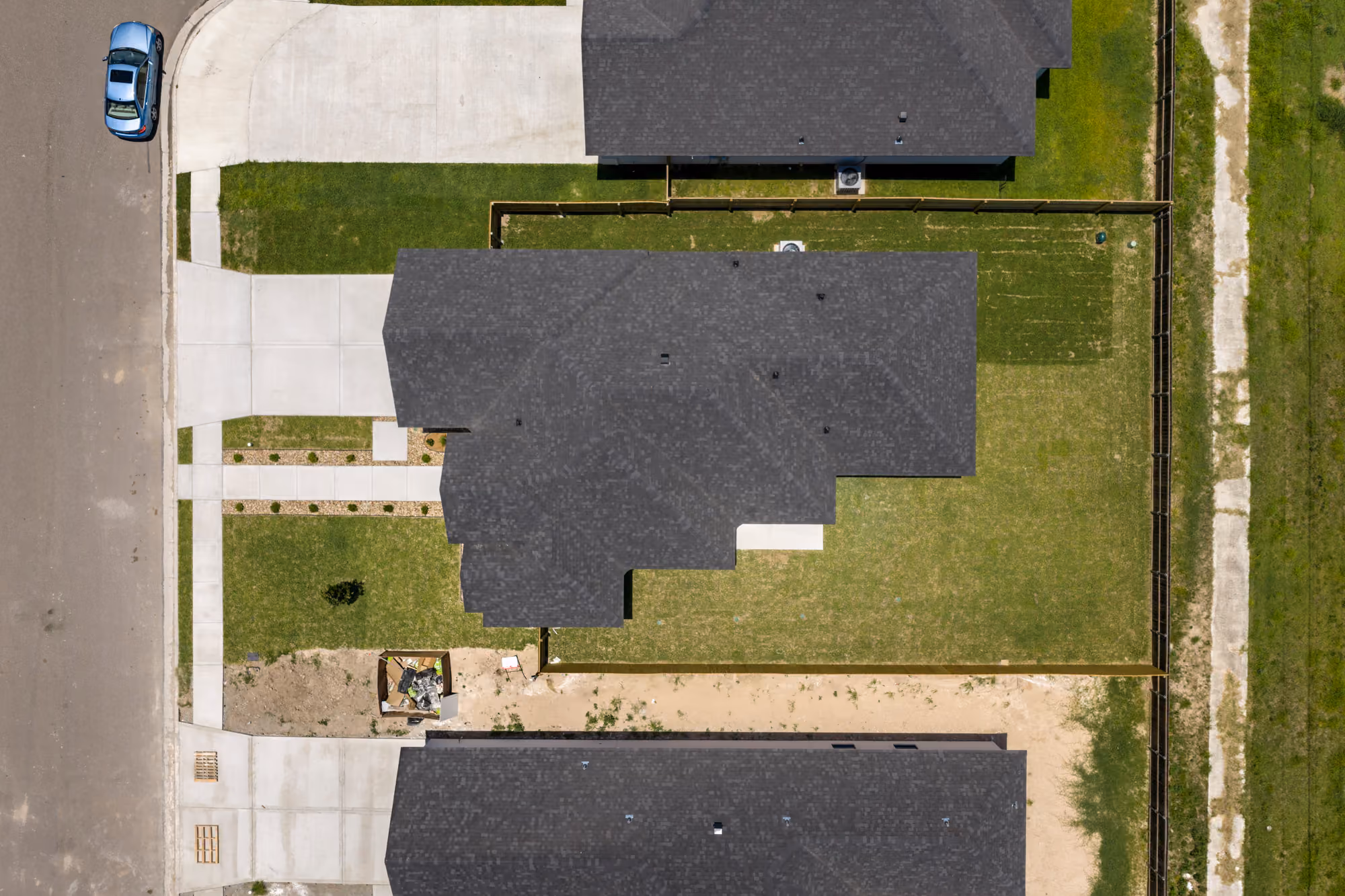 Overhead aerial showing the lot, roofline and how the house sits on the block