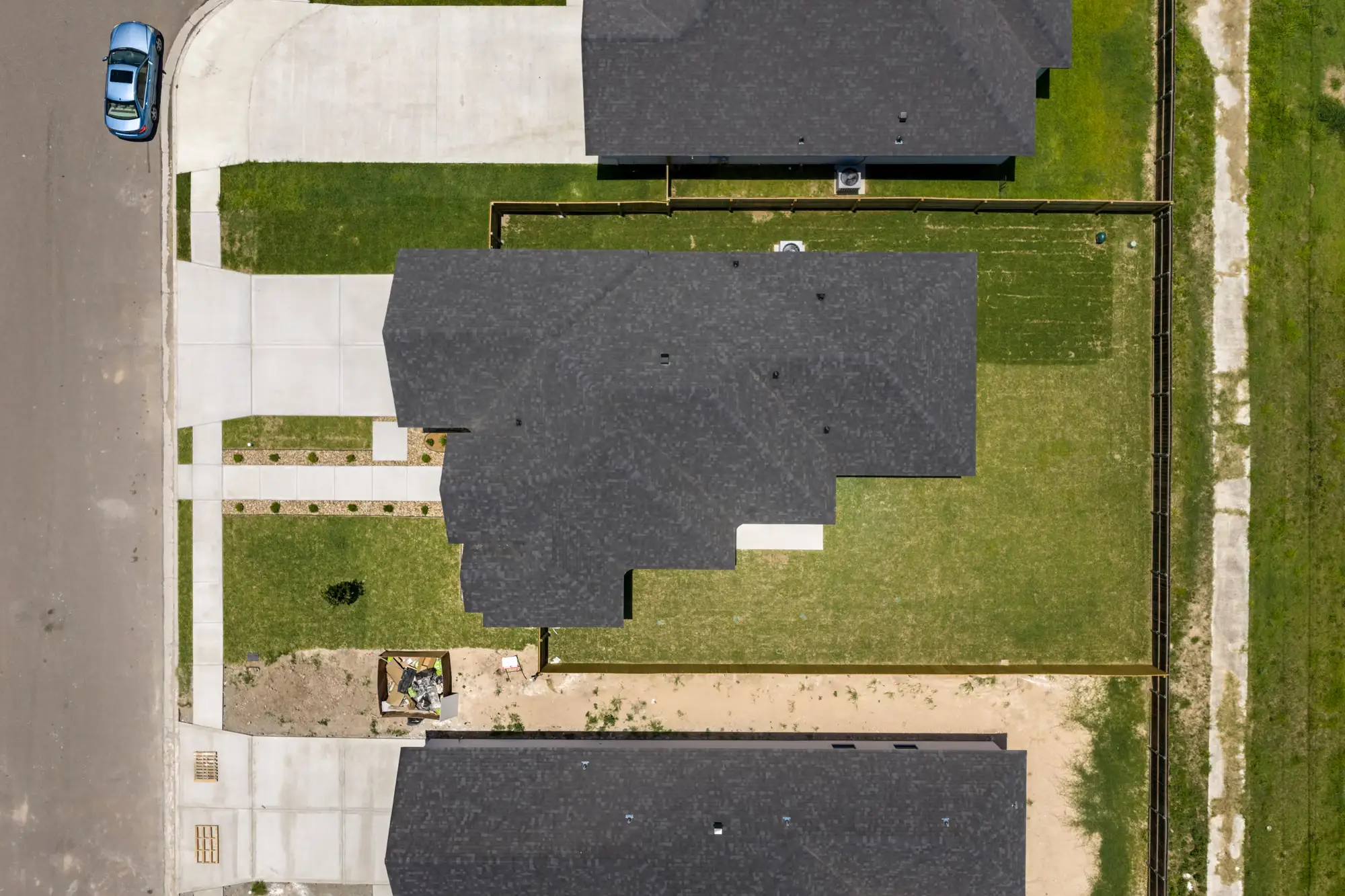 Overhead aerial showing the lot, roofline and how the house sits on the block