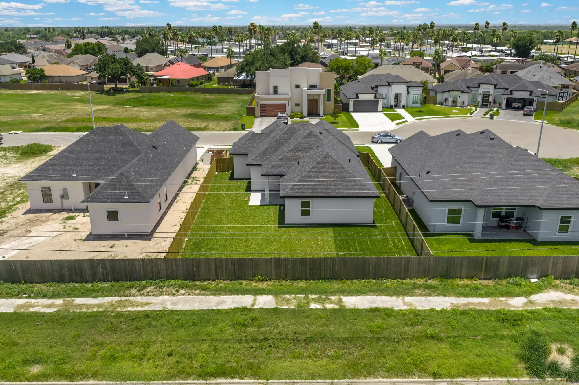 Aerial from the rear of the finished home inside the gated Laguna Oaks community