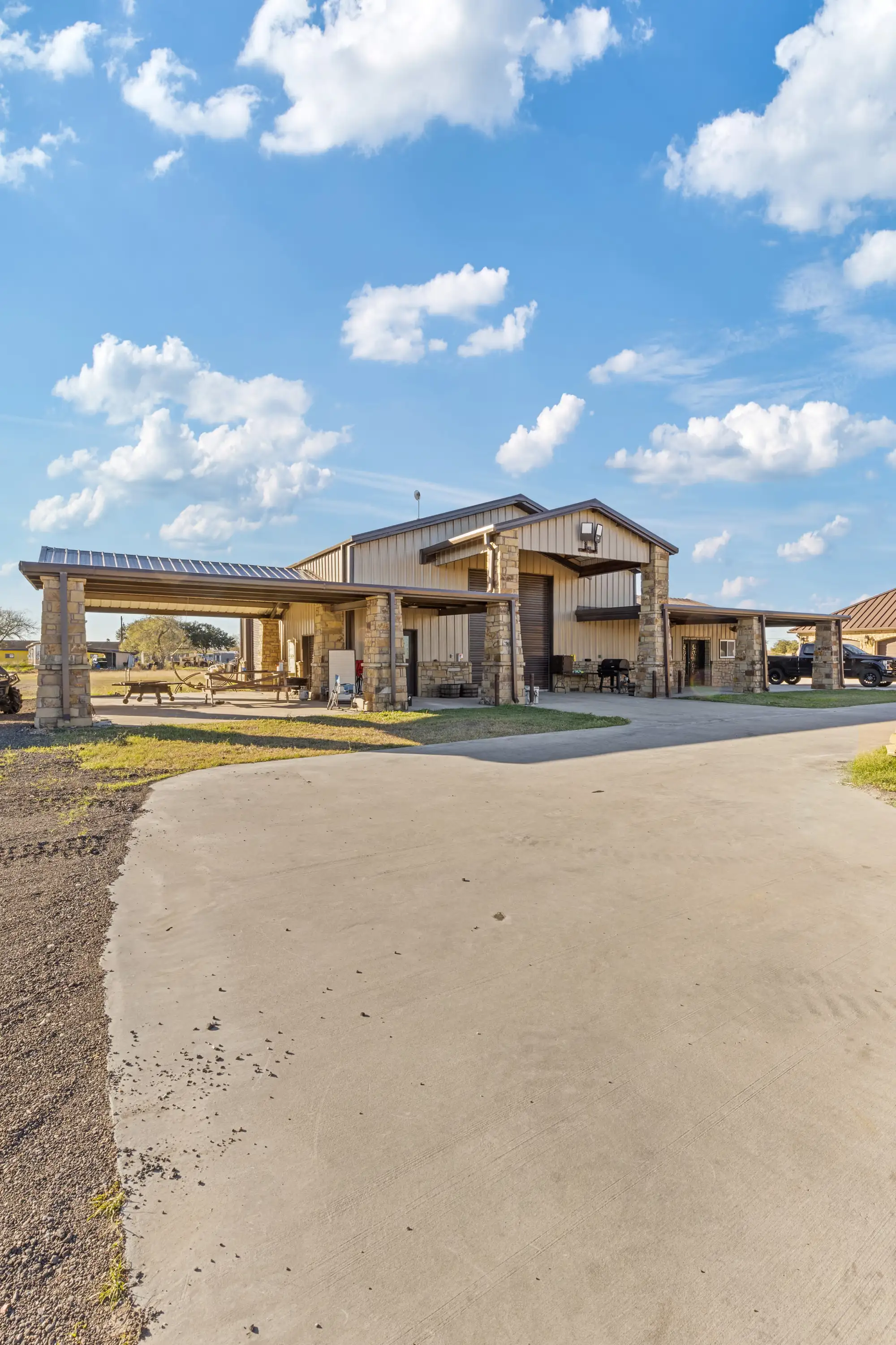 Metal workshop and storage barn detailed to match the main house