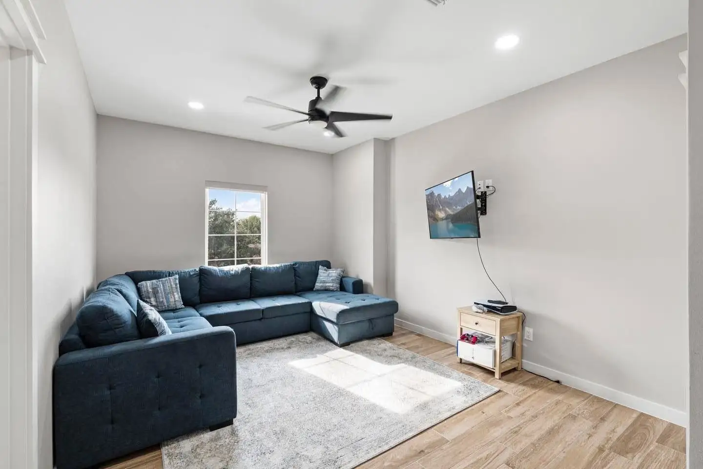 Furnished family room with daylight from the side window
